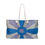 Thumbnail: A canvas weekend tote bag with a blue and purple abstract design, reminiscent of Mexican tile style.