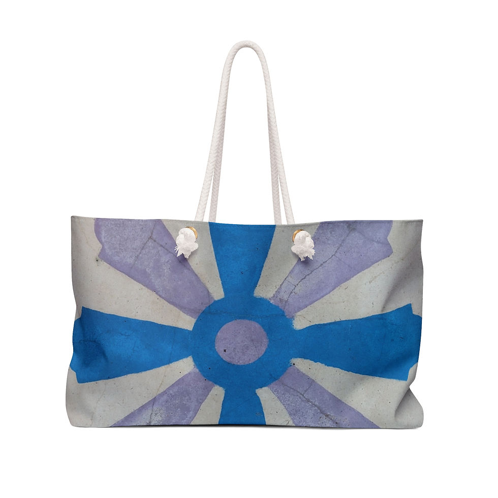 A canvas weekend tote bag with a blue and purple abstract design, reminiscent of Mexican tile style.