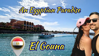 A couple poses for a selfie by the water with buildings in the background. The text reads "An Egyptian Paradise, El Gouna," with a graphic of the Egyptian flag.