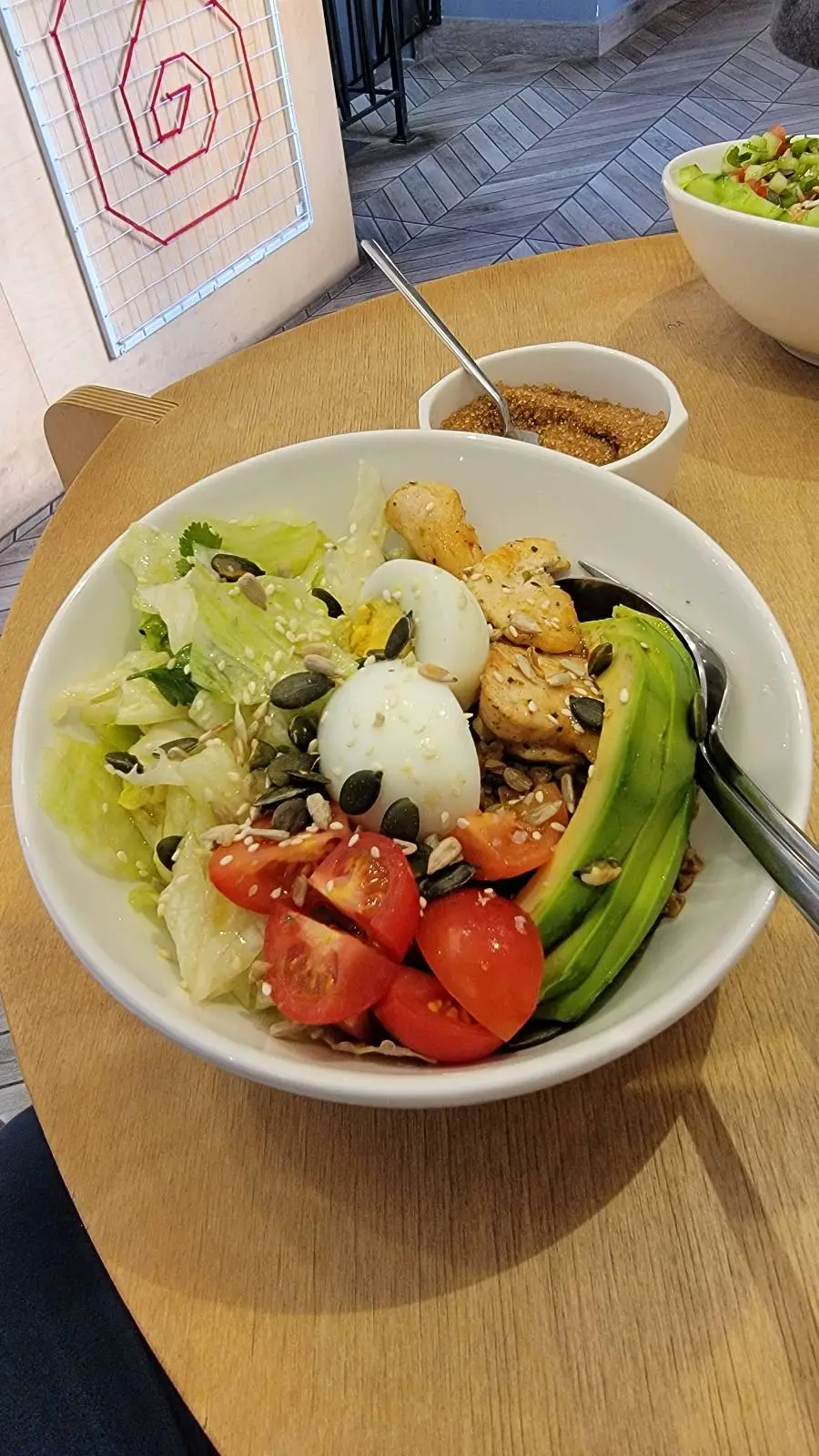 Tomato, egg, avocado, nuts and green salad.