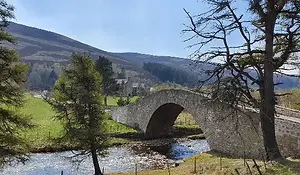 Scenic view of Cairngorms National Park in Scotland, featuring wide open landscapes and mountains.