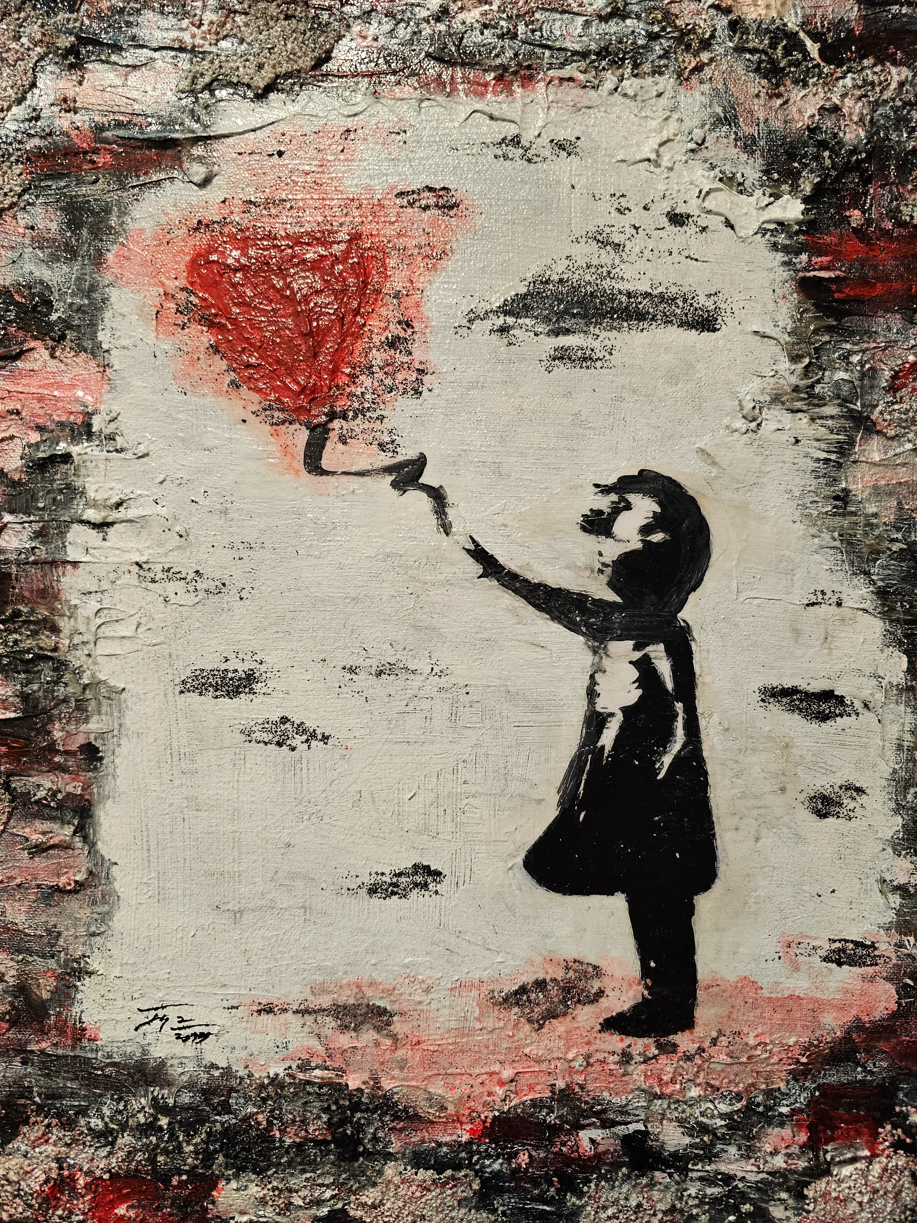 A stencil-style image shows a child reaching up with a paint roller, creating a red heart on a weathered, textured wall. The background is mostly white and gray with hints of red, giving a rough, urban feel.