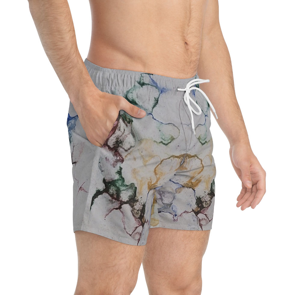 Man wearing marble-patterned swim shorts with hands in pockets, against a plain background.
