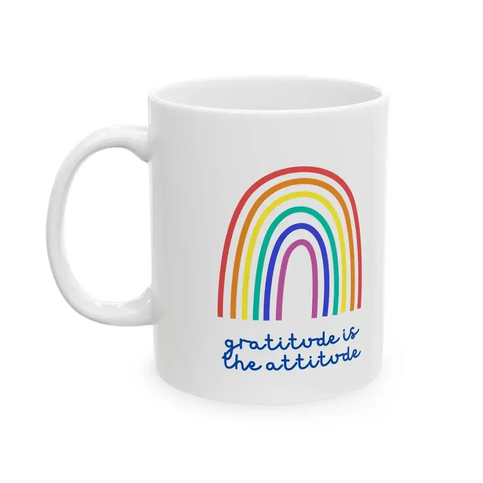 Thumbnail: Front view of white ceramic mug with rainbow and “Gratitude is the Attitude” text.