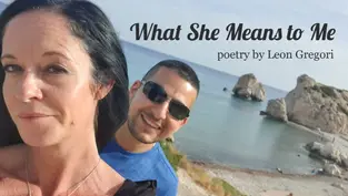 A woman and man smiling by the sea with large rocks. Text: "What She Means to Me, poetry by Leon Gregori." Bright, sunny day.