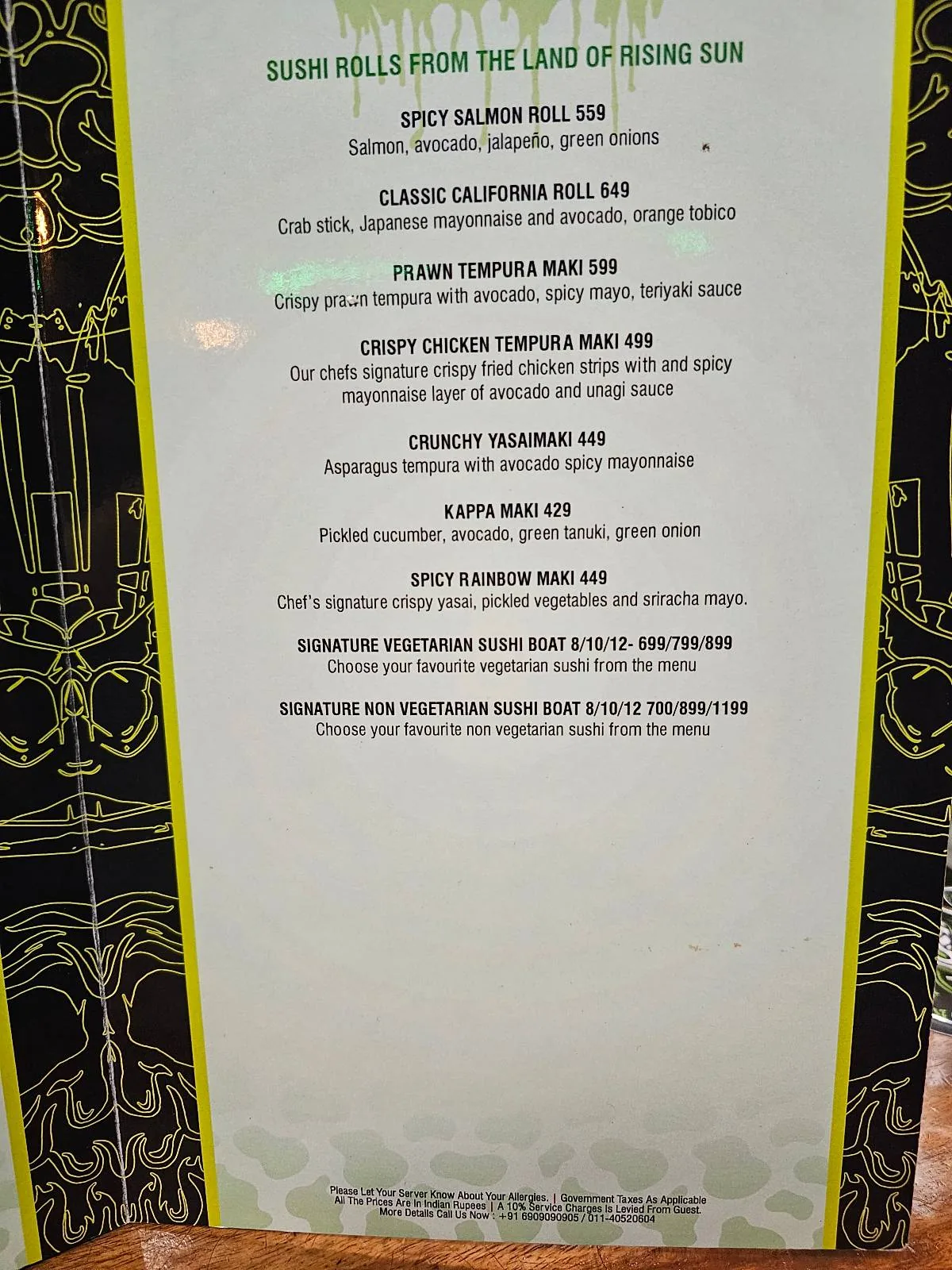 A restaurant menu with green decorative borders listing several dishes under the heading “GLUTEN INTOLERANCE.” Each dish has a name and a description of its ingredients or preparation. Text is small but visible.