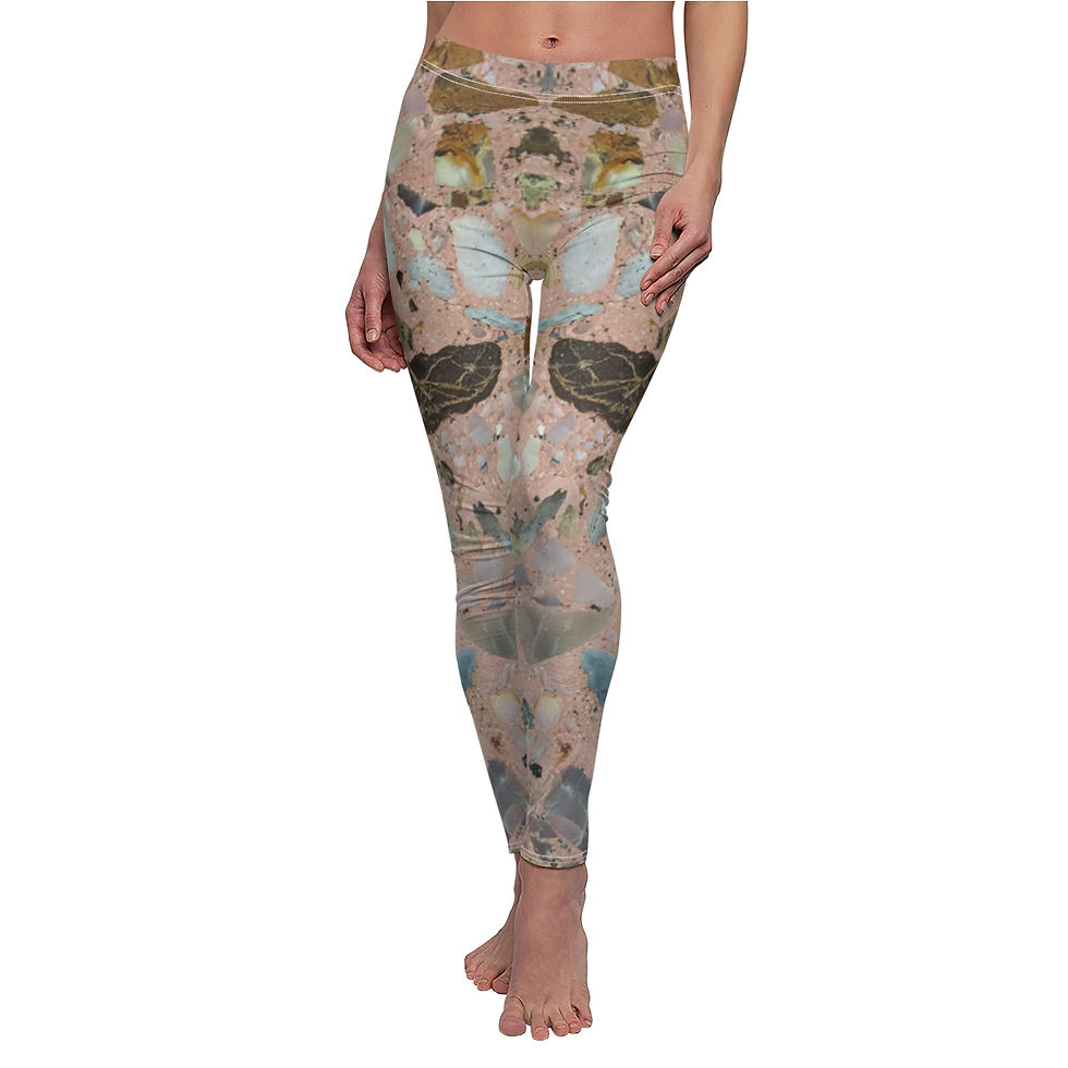 A person stands barefoot, showcasing casual leggings that feature a mesmerizing crystal rock pattern.