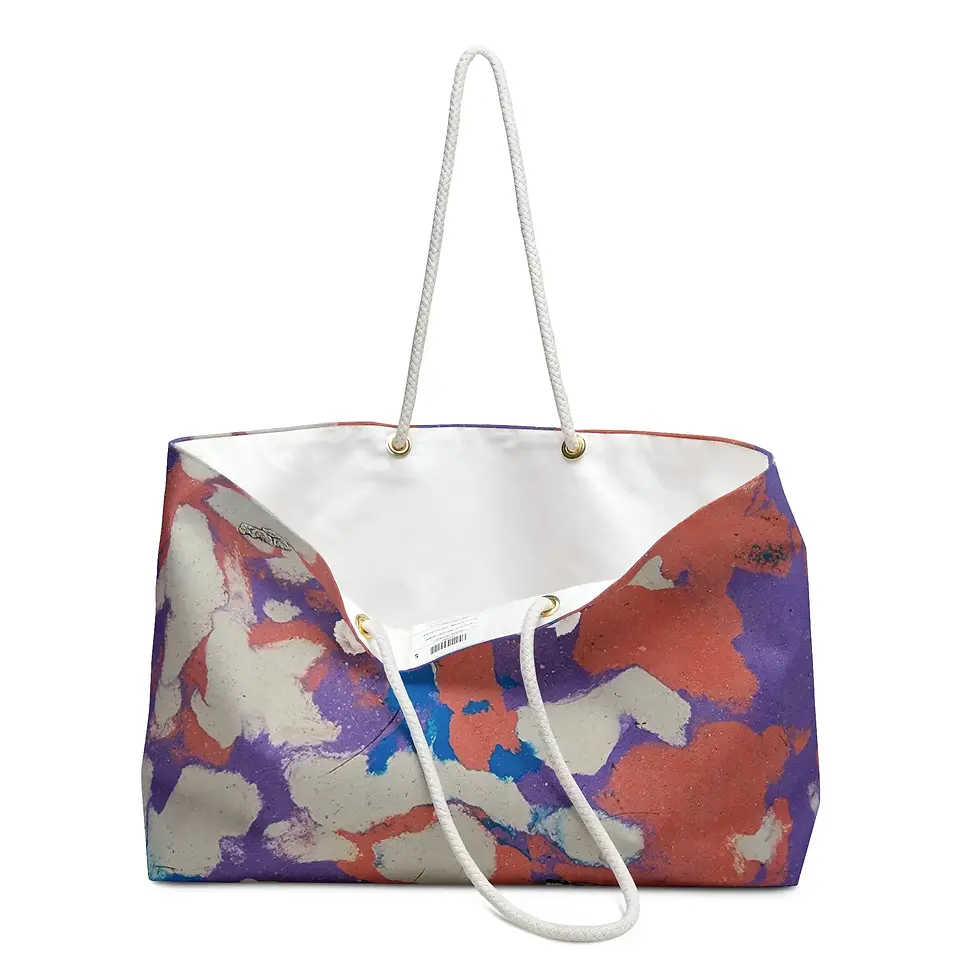 Thumbnail: A stylish tote bag with a colorful abstract pattern in shades of red, purple, blue, and cream, featuring white handles.