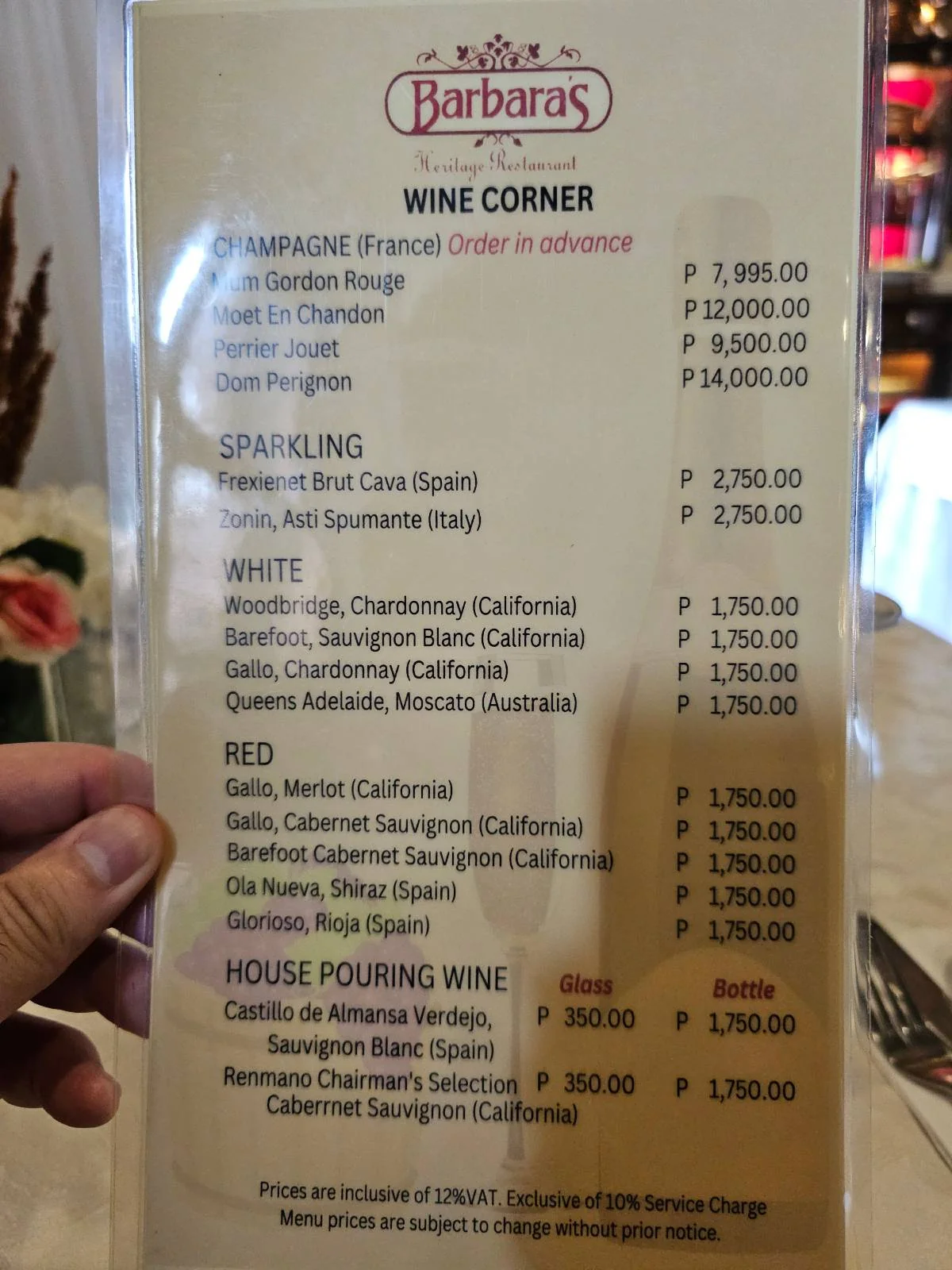 A wine menu from Barbara's shows Champagne, sparkling, white, and red wine options with prices ranging from P700 to P2,995. House pouring wine prices are P200 per glass and P800 per bottle.