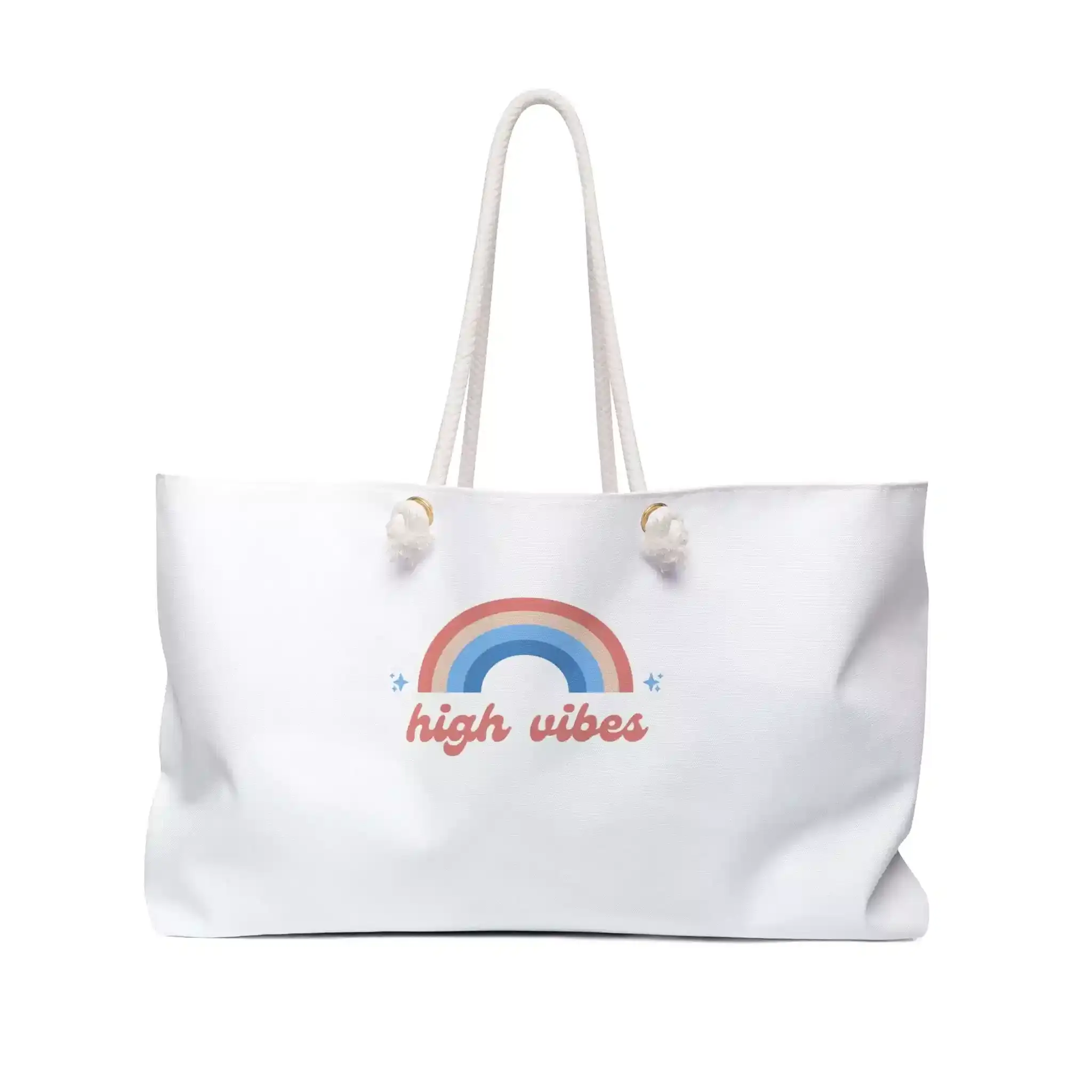 A white tote bag features a colorful rainbow design and the phrase "high vibes" printed underneath, with sturdy rope handles.