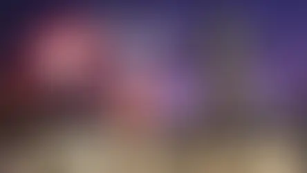 Statue of a martial artist in a fighting pose on the Avenue of Stars in Hong Kong, with city lights in the background and the words "Avenue of Stars" in white text.