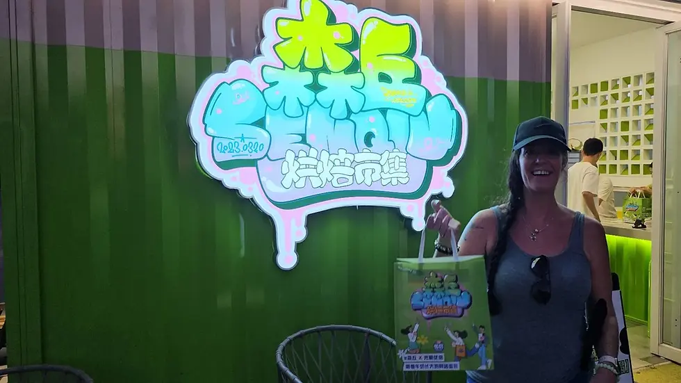 Woman smiling, holding a green shopping bag outside a shop with a large neon sign in Chinese. Bright green and pink colors dominate the scene.