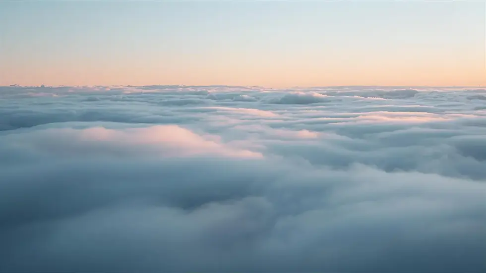 Soft clouds passing through the sky symbolizing impermanence and passing thoughts.