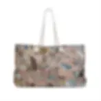 A stylish tote bag featuring a colorful, abstract terrazzo pattern with a mix of earthy tones and blue accents.