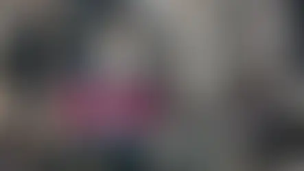 Ancient stone faces at Bayon Temple, Cambodia. Text "Bayon Temple" over colorful brush strokes. Serene, historical atmosphere.