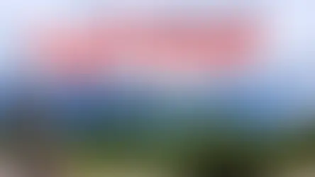 Text reads "Top Reasons to Visit Banff" over a scenic view of mountains and evergreen trees, with a red maple leaf and Canada outline.