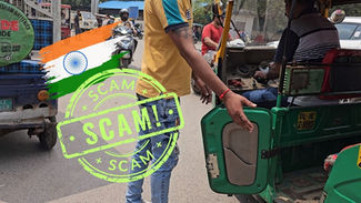 Person in yellow shirt approaches green auto rickshaw on busy street. Indian flag and "SCAM" text overlay. Urban background.