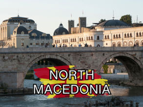 Stone bridge with people walking across it, historic buildings in the background, and a graphic overlay of the North Macedonian flag with the text "NORTH MACEDONIA—perfect for your next budget travel adventure!
