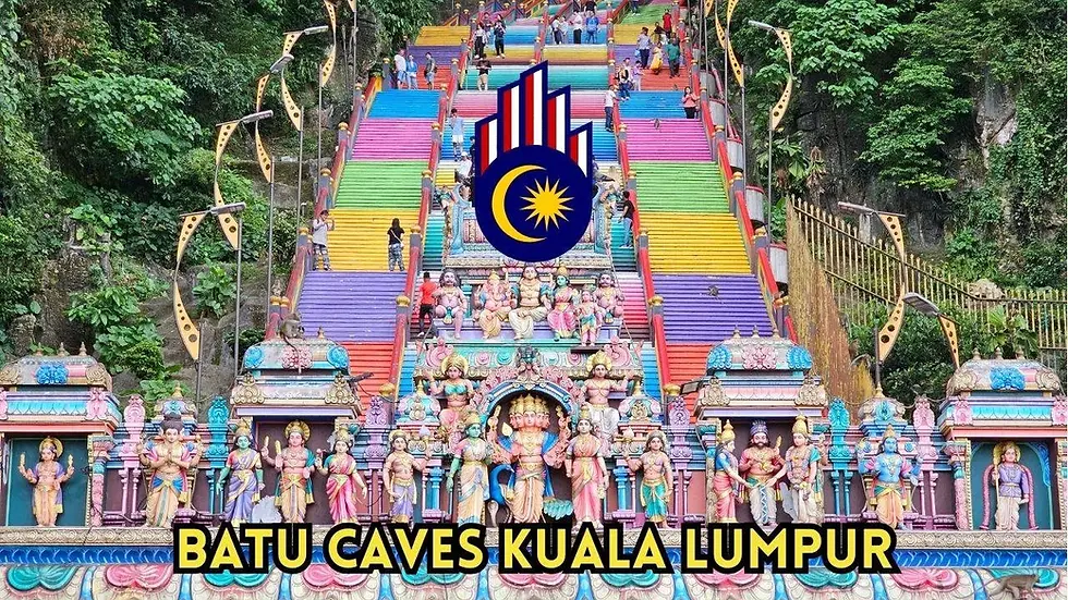 Colorful Batu Caves stairs with people climbing, vibrant statues at the base, lush greenery. Text: "BATU CAVES KUALA LUMPUR."