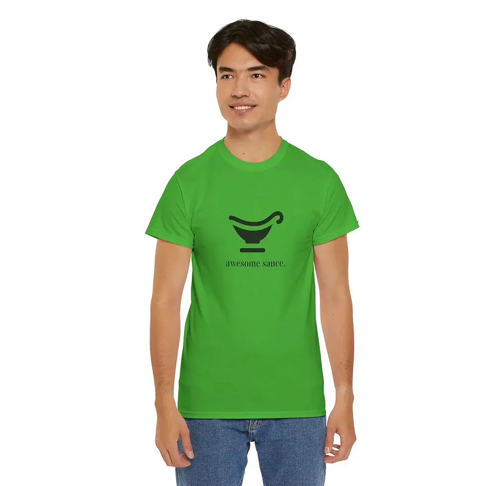 Smiling man in a green t-shirt with a printed graphic. Closer Lives