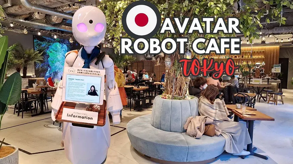 Robot with screen in a cafe setting. Sign reads "Avatar Robot Cafe Tokyo." People sit at wooden tables, greenery decorates the space.