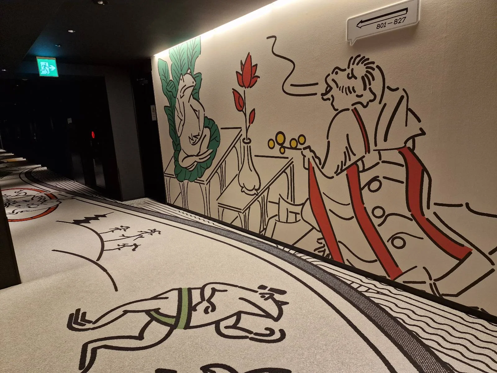 A hallway features whimsical wall art depicting a smoking figure in an overcoat, a seated character, and a dancing animal on the carpet. The scene uses simple lines and muted colors, creating a playful and artistic atmosphere.