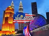 Night view of Kuala Lumpur skyline featuring lit-up buildings and Petronas Twin Towers; Malaysia flag graphics and the word "MALAYSIA" overlaid in bold text at the center bottom.