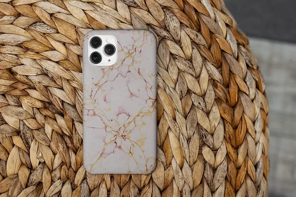 Marble phone case with gold and pink veins on woven background Closer Lives
