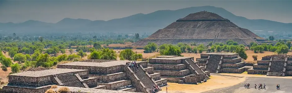 Teotihuacán pyramids and ancient Mesoamerican ruins under a clear blue sky during a cultural trip to Mexico.