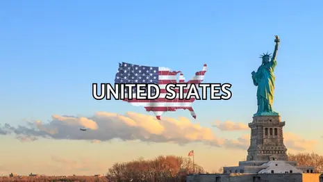 The Statue of Liberty stands in the foreground with the sky and trees behind. A map of the US with an American flag overlay and the text “UNITED STATES” appear in the center.