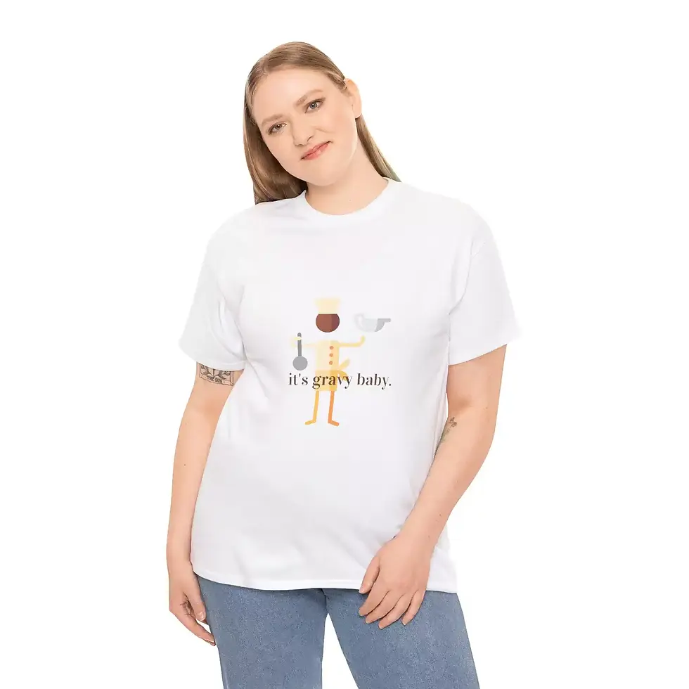 A person wearing a white T-shirt with a playful illustration of a chef with a gravy boat against a plain background.