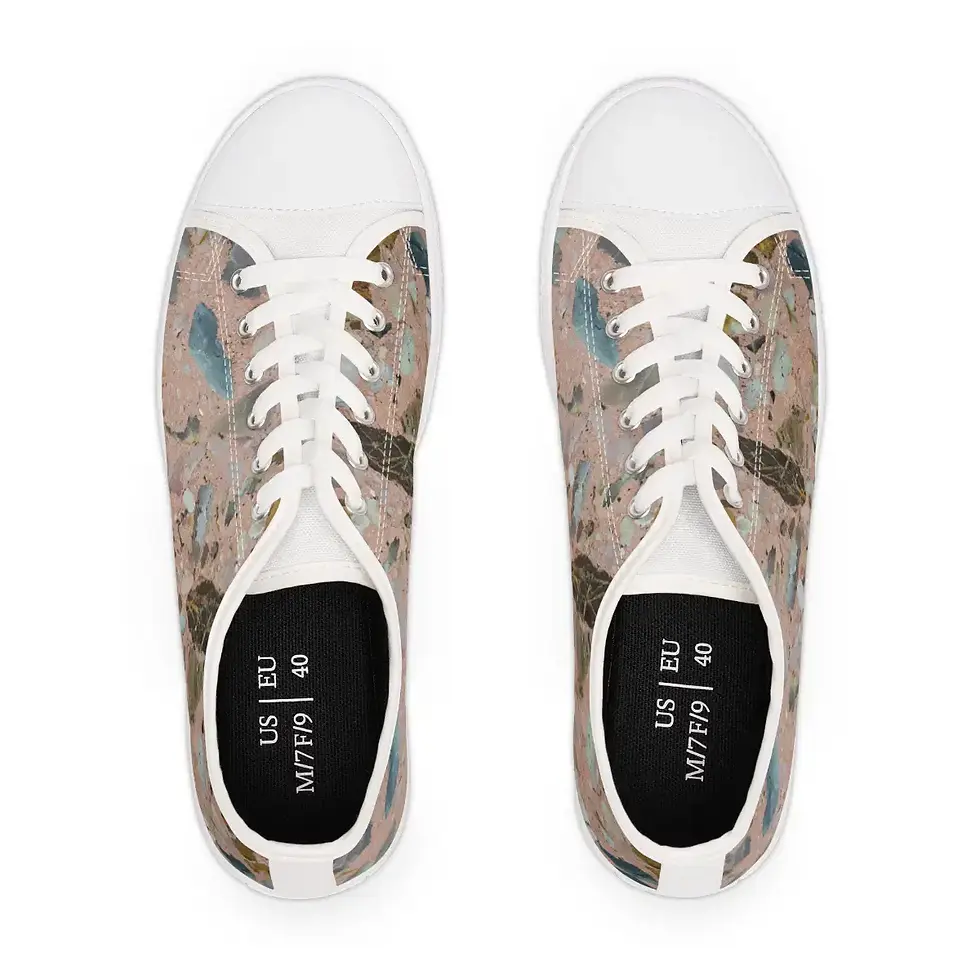 Thumbnail: A pair of stylish sneakers with a colorful, terrazzo pattern on the sides and white toe caps and laces, viewed from above.