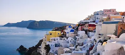 Traditional whitewashed buildings and blue sea views on the island of Mykonos, Greece.