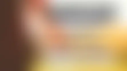 Person holding a globe; text reads "25 Cool Terms for Remote Workers, Nomads & Global Citizens. Which One Are You?" Warm, sunny background.