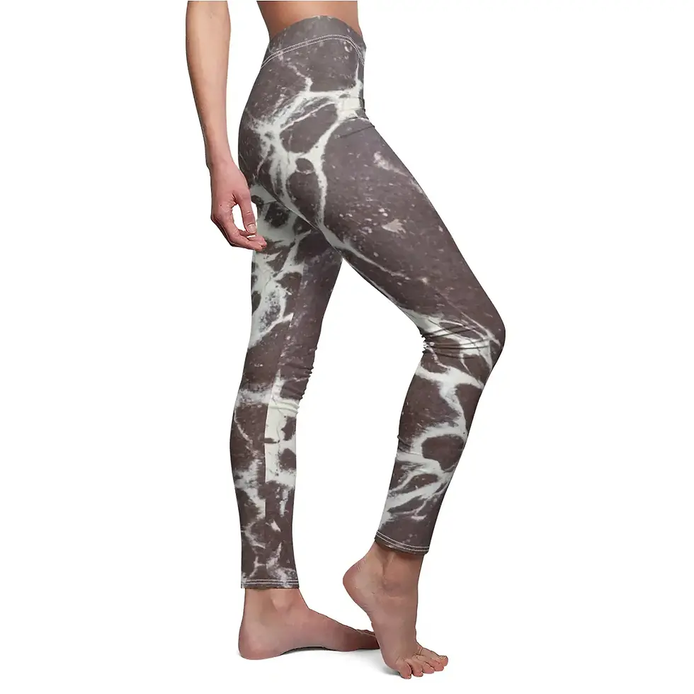 Woman wearing gray patterned leggings, standing on a white background Closer Lives
