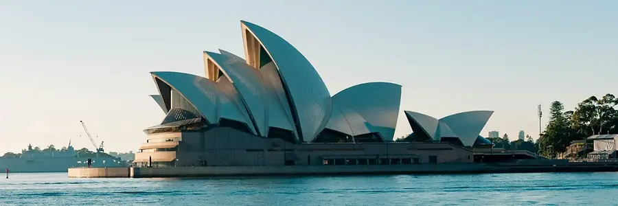 Sydney Opera House on Sydney Harbour, Australia country travel guide hero image featuring the iconic waterfront landmark.