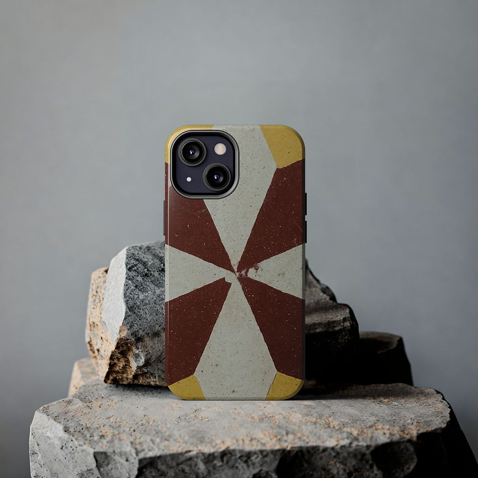 A smartphone with a geometric-patterned case featuring brown, cream, and yellow sections is propped upright.