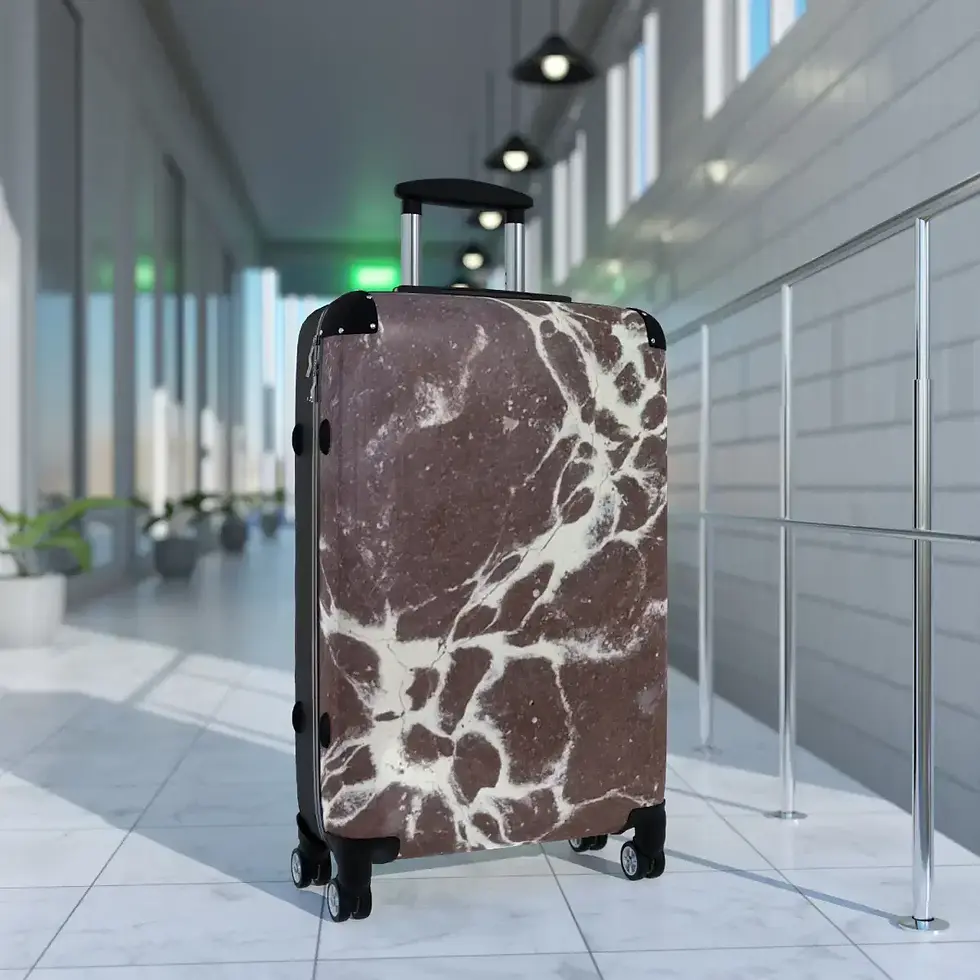 Thumbnail: A brown marble-patterned suitcase stands on a tiled walkway in a modern, well-lit corridor with glass and metal railings.