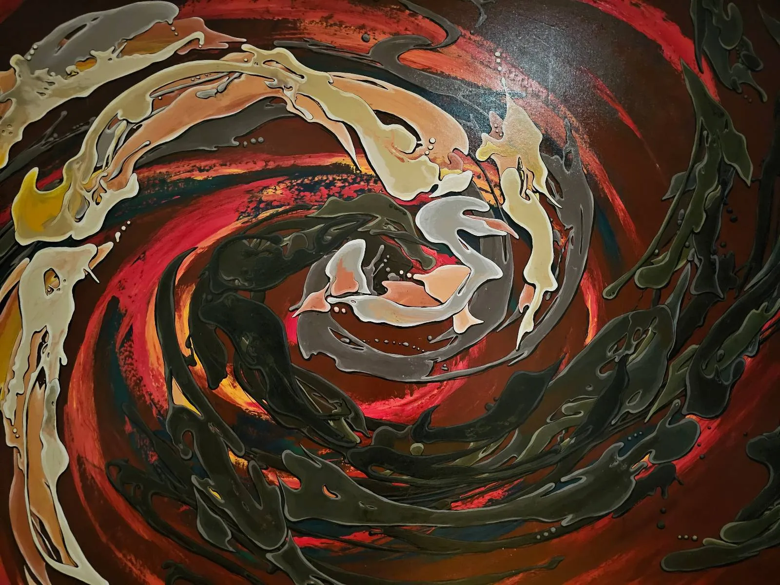 Abstract painting featuring swirling patterns in shades of red, black, brown, and beige, creating a vortex-like effect with dynamic, flowing shapes and contrasting colors.