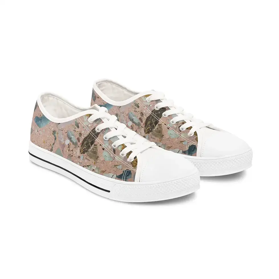 A pair of casual white sneakers with a colorful abstract pattern on the sides, featuring lace-up fronts and a sleek design.