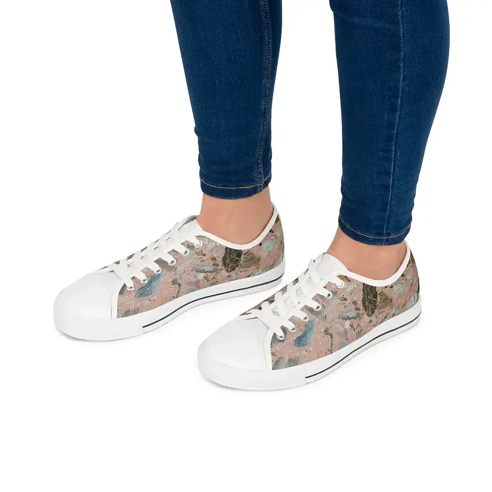 Thumbnail: A person wearing blue jeans and stylish sneakers with a colorful, terrazzo pattern and white toes.