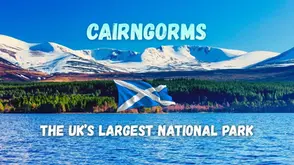Landscape of the Cairngorms National Park with snow-capped mountains and a Scottish flag. Text overlay reads: Cairngorms, The UKโs Largest National Park.