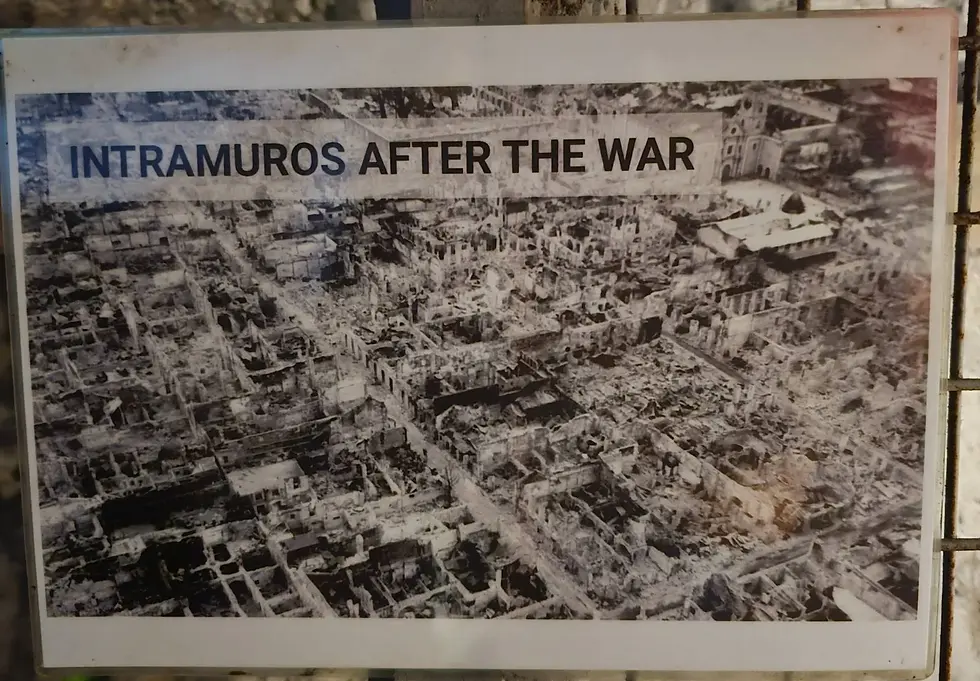 Black and white aerial photo labeled "Intramuros After the War," showing extensive ruins and destruction of buildings in a historical setting.