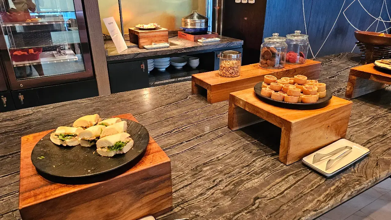Afternoon canapé buffet featuring savoury bites, pastries and small desserts.