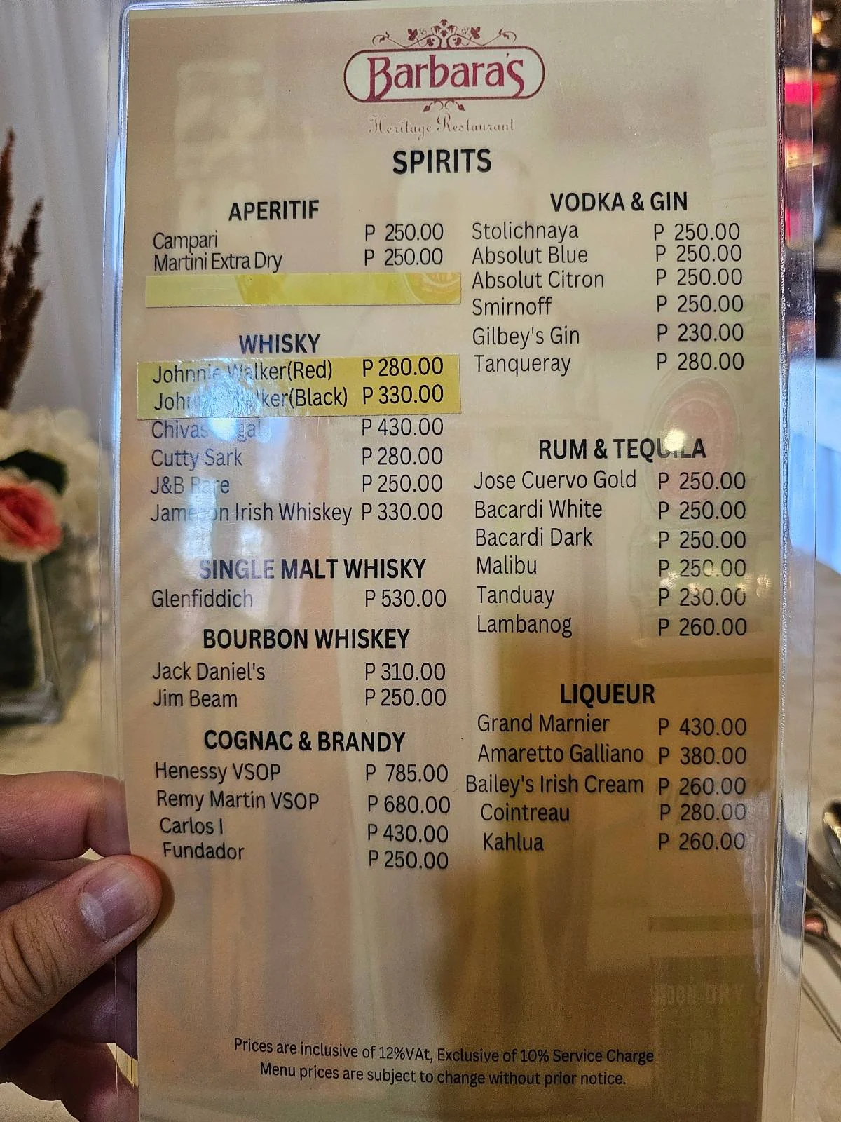 Restaurant menu with prices for spirits, including whiskey, vodka, gin, rum, tequila, bourbon, brandy, cognac, and liqueur.