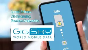 Hand holding a smartphone displaying SIM and eSIM options on the screen. The text reads: "Local Prices. No Roaming. Fastest Networks." The image includes the GigSky World Mobile Data logo.