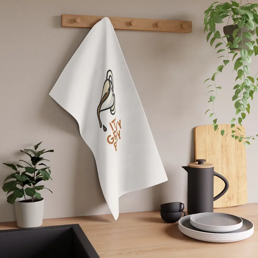 White towel "IT'S GRAVY BABY" text displayed in a kitchen setting.