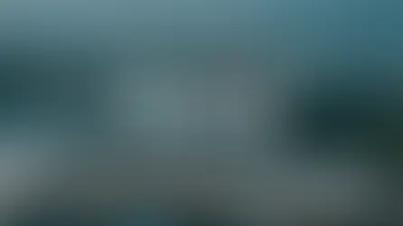 Aerial view of Marina Bay Sands SkyPark with text: "MARINA BAY SANDS SKYPARK Our honest review." Ocean and ships in the background.