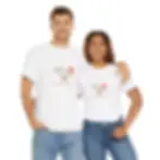 A man and a woman stand side by side, both wearing white T-shirts with a colorful gravy boat and text on the front.