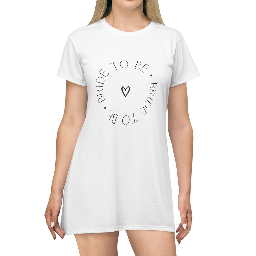 Person wearing a "Bride to Be" T-shirt dress with a heart symbol, perfect for bridal showers or bachelorette parties.